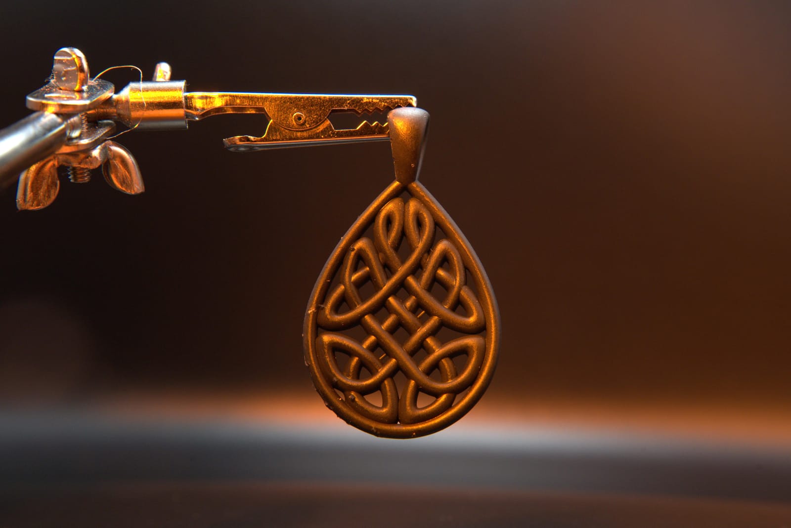 Close view of the Celtic knot pendant showing daylight between every interwoven strand