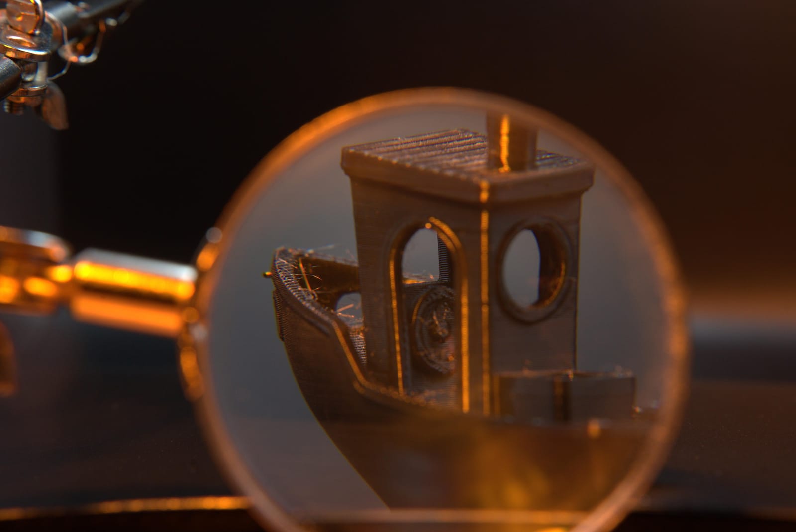 Magnified view of the filament print's cabin windows, showing how cleanly FDM holds a small opening