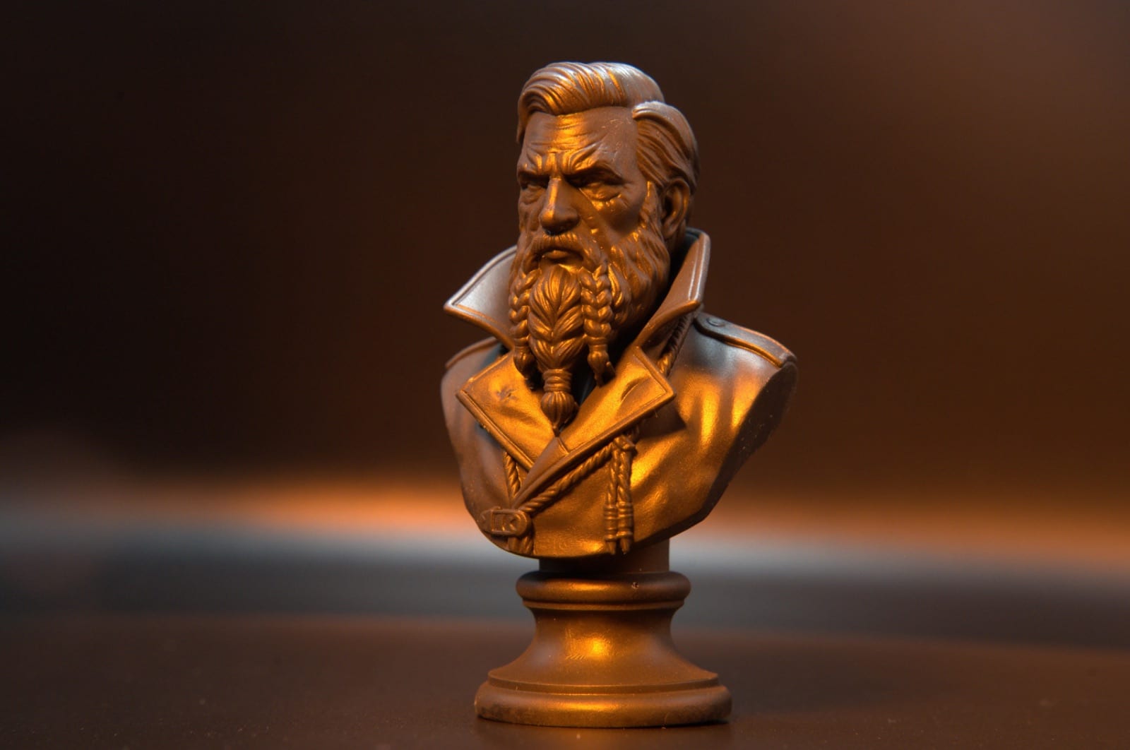 Copper resin character bust at an angle, showing hair-strand resolution in the beard and coat